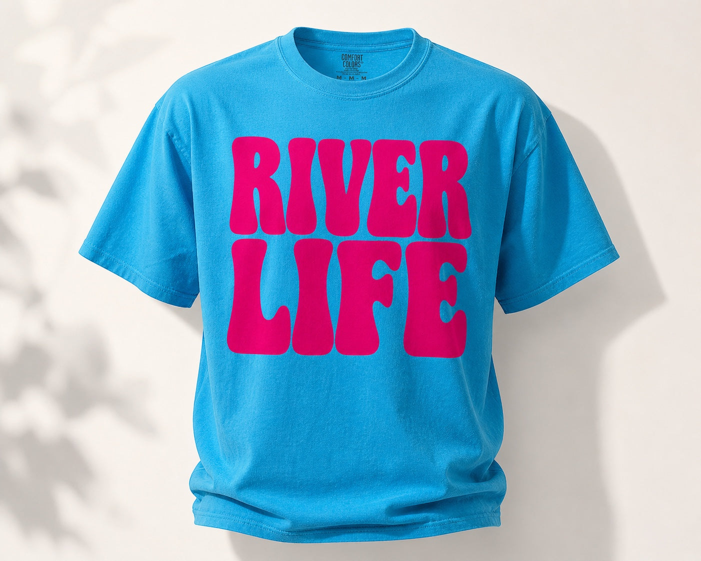 Press Society blue cotton t-shirt with pink "River Life" retro bubble lettering, short sleeves, crew neck.