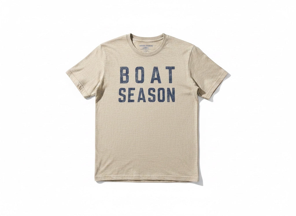Press Society beige heathered cotton t-shirt with navy blue distressed "BOAT SEASON" graphic print on the front.