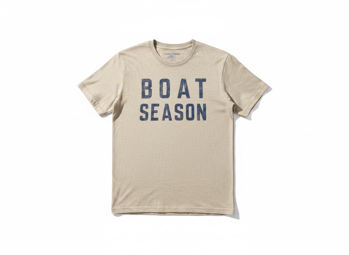 Press Society beige heathered cotton t-shirt with navy blue distressed "BOAT SEASON" graphic print on the front.