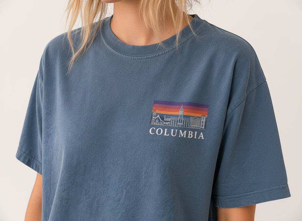 Press Society blue cotton t-shirt with a graphic print of Columbia University buildings at sunset.