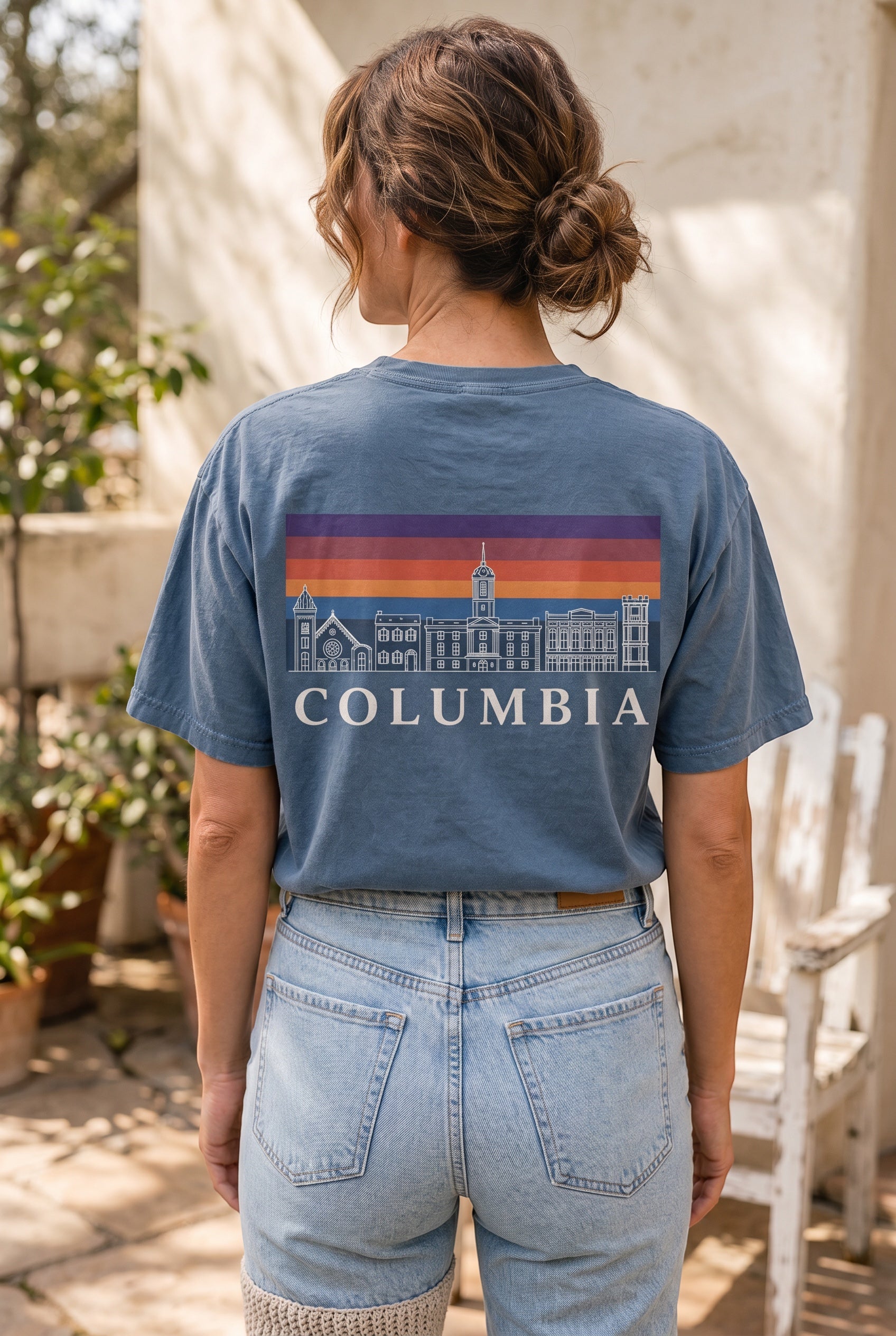 Press Society blue cotton t-shirt with a graphic print of the Columbia skyline and sunset.