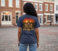 Press Society blue cotton graphic t-shirt with a sunset over Columbia, TN courthouse graphic on back and pocket logo.